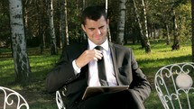 businessman using a tablet outdoors 