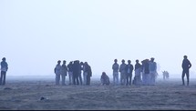 gathering of tribesmen in a desert 