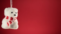 Polar bear decoration for Christmas with red background 