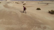 person hiking in a desert 