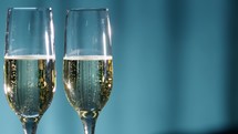 New Year background with sparkling wine glasses
