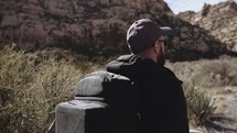 a man hiking alone through the desert 