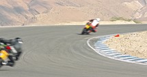 Slow motion of sport motorcycles making turns during a race