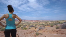 a woman viewing a desert oasis 