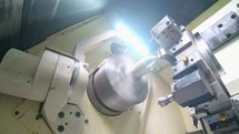 Metal lathe close-up. production of high precision metal parts
