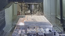 Slow motion of CNC mill manufacturing an advanced metal part