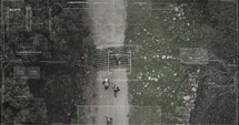 Surveillance drone camera view of terrorist squad walking with weapons