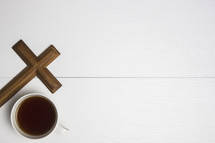 coffee cup and wooden cross 