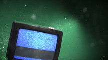 Old TV playing static with particles.