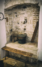 Old fireplace used for cooking inside a trullo in Alberobello.