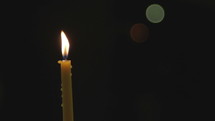 Candle light. Black background.