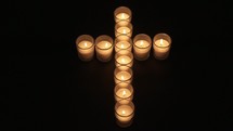 candles in the shape of a cross