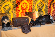 ancient armor trunk and bag on table