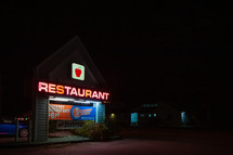 restaurant sign at night 