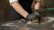 Hand With Gloves Are Mixing Bakery Flour For Food In Kitchen