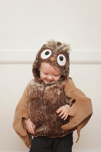 toddler boy in a owl Halloween costume 