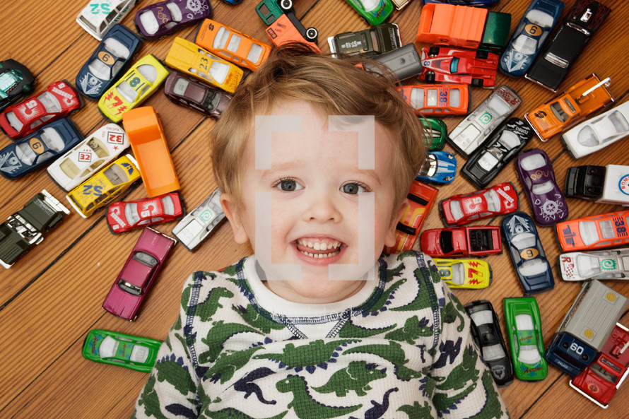 boy child with toy cars 