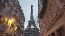 The majestic Eiffel Tower as seen from the residential area of Rue de l'Université, Paris.