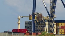 Cranes load and unload containers from cargo ships