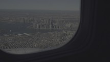 view of a city out an airplane window 