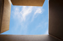 looking into the sky through an open box.