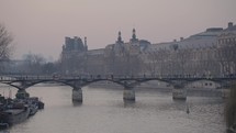 Musée du Louvre Museum and Pont des Arts Picturesque Bridge Paris, France