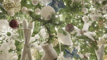 Beautiful Illuminated Christmas Tree Decoration. Snow Balls, Blue Flowers, White Owl and Ice Skates Ornaments. Close Up.	

