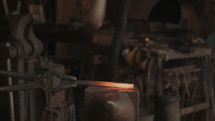 Blacksmith hammering metal 