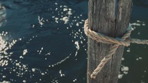 rope around a post on a dock 