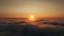 Descending below clouds during sunset