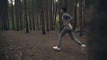  man running in the woods 