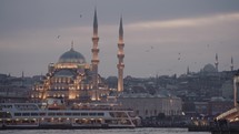 İstanbul Türkiye Old City Cityscape and Yeni Cami Mosque from Galata Köprüsü Bridge Sunset Istanbul, Turkey