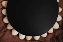 eggs around a black circle 