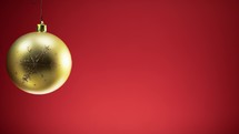 Christmas gold ball with red background 