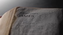 Light revealing a Bible and the book of James
