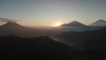 Sunrise in Kintamani Bali Indonesia Coffee Shop looking at Mount Batur Volcano Blanket Clouds in the Morning