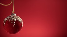 Red Christmas ball with red Background 