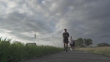 Three healthy active Asian Indonesian Men Running in Slow Motion 