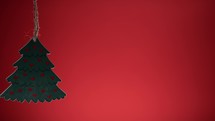 Small Christmas tree with hearts and red background