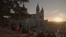 Crowd of People and Catedral de la Almudena during Sunset Madrid, Spain