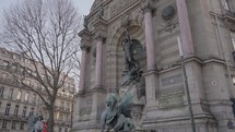 Archangel Michael and the devil Fontaine Saint-Michel Stone fountain Paris, France