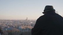 Unknown Man Tourists enjoys the view of Paris from atop Montmartre