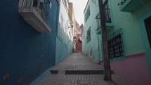 Walking on Small Narrow Street Alley with Colorful Buildings Guanajuato, Mexico