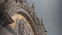 The details and mosaic art paintings exterior of The Patriarchal Cathedral Basilica of Saint Mark, commonly known as St Mark's Basilica, Venice.