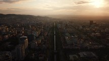 Aerial sunset view city of Tirana Albania with scenic golden clouds in the background