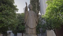 Seville, Spain - Pope John Paul II statue in front of Catedral de Sevilla Santa Maria de la Sede