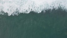 Aerial Top View of Beautiful Waves Wave on The Beach Ocean