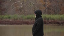 Inspiration, Lonely, Alone, Zen, Peaceful, Cold - Unrecognizable Man with Black Jacket Standing on the Lake Side Autumn Fall Foliage Trees Arkansas