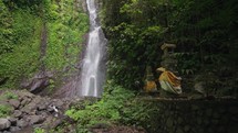 Les Waterfall (Yeh Mempeh or Flying Waterfalls) in Tejakula Village, Buleleng, Bali - Secluded Cascade Surrounded by Rainforest, Cliffs Overgrown with Green Tropical Plants