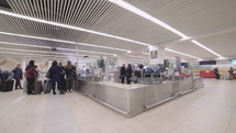 time lapse of passengers in airport terminal going through security check